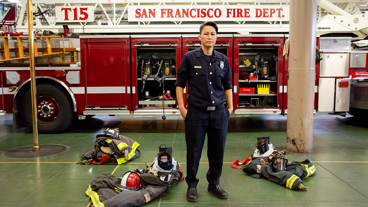 Maiko Bristow, a firefighter and EMT with the San Francisco Fire Department, stands in her firehouse