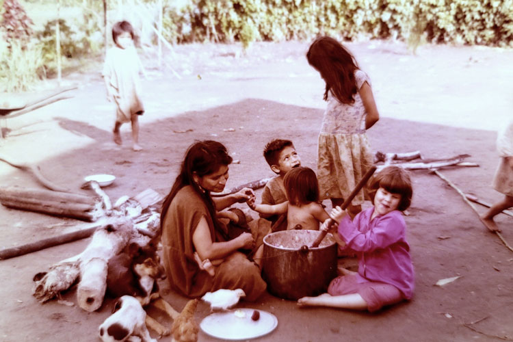 Ana Weiss, makes masa, a fermented beverage, with an Ashaninka family in Peru in the early 1960s.