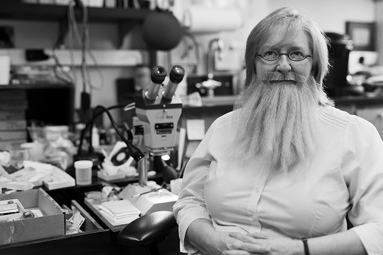 Paleontologist Patricia Holroyd wearing a beard