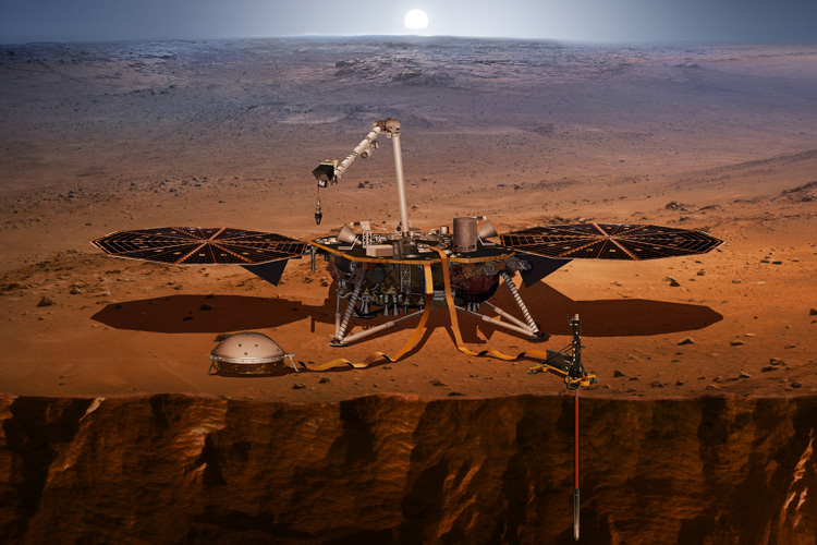 Depiction of the InSight mission lander that is pictured right above a crater on Mars