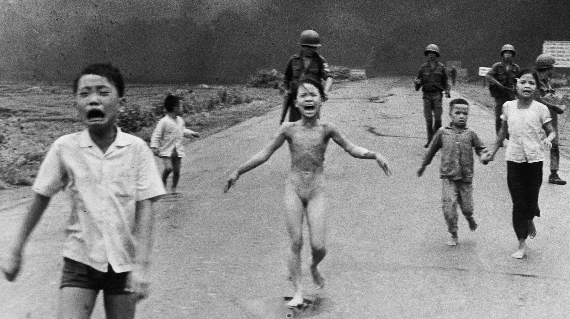 Kim Phúc, then 9, screams as she runs from a napalm attack on her village during the Vietnam War 