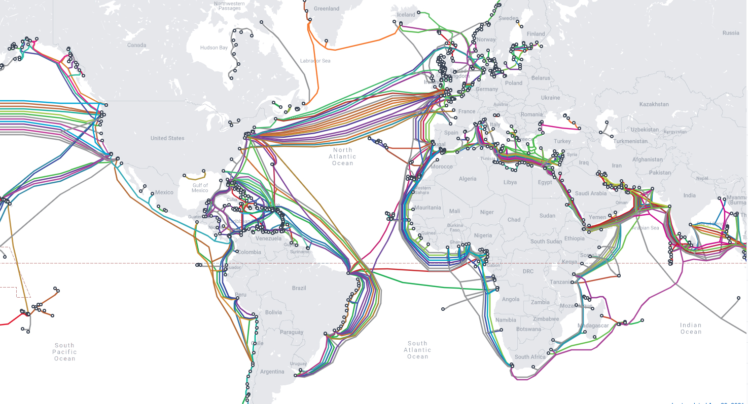 a map that shows hundreds of lines in different colors connecting the coasts of countries all over the world. each line represents a submarine telecommunication cable.