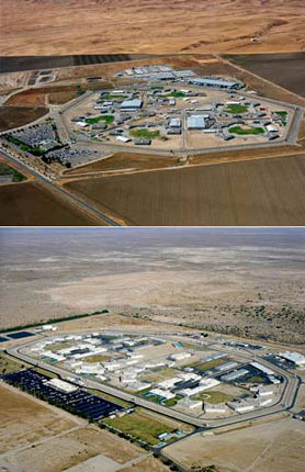 Aerial view of barren prison complexes in California.