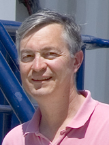 Jim Bishop wearing a pink shirt.