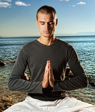 Stock photo of a man meditating.
