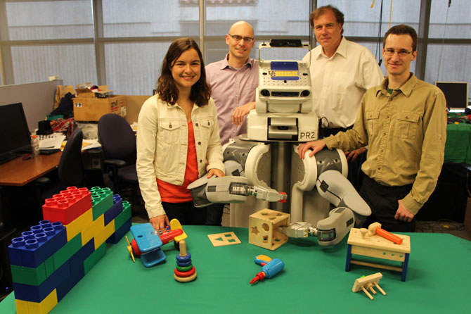 Team photo of UC Berkeley researchers with PR2 robot.