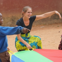 Prof. Hannah Sande interacting with children during a research trip in Gnagbodougnoa, Côte d'Ivoire