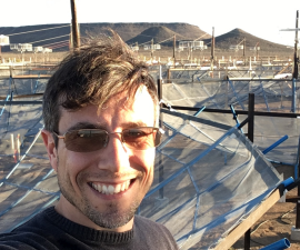 Aaron Parsons in front of the Hydrogen Epoch of Reionization Array in South Africa