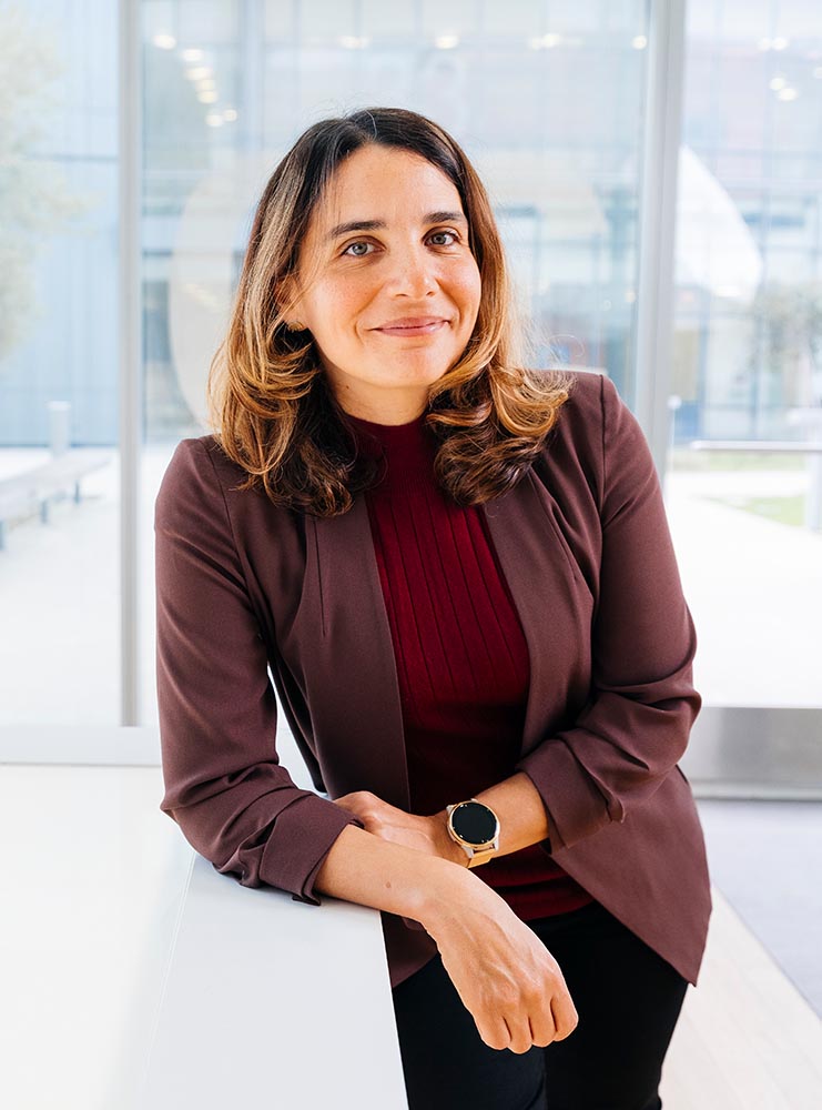 image of woman posing leaning against a counter