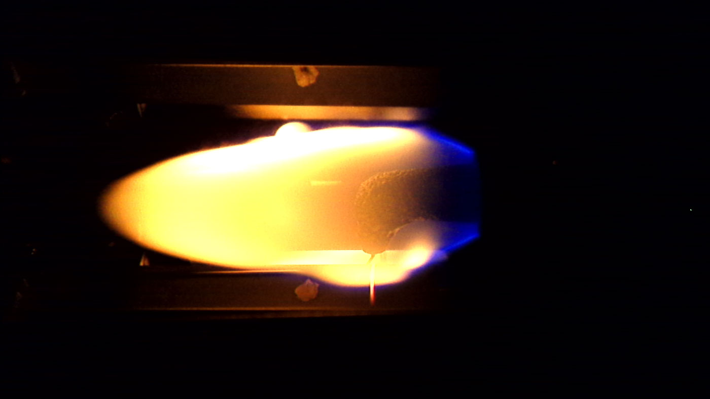 Flame spreading over a 9.5 mm sample at 17.8% oxygen under 100 kPa ambient pressure in microgravity.