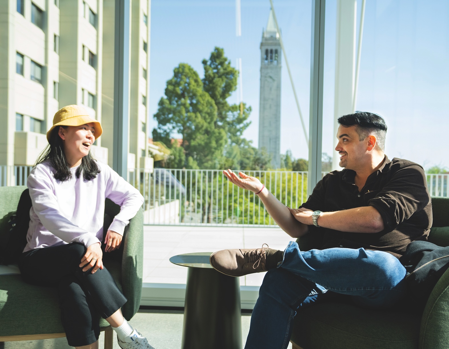 image of two people talking while sitting down