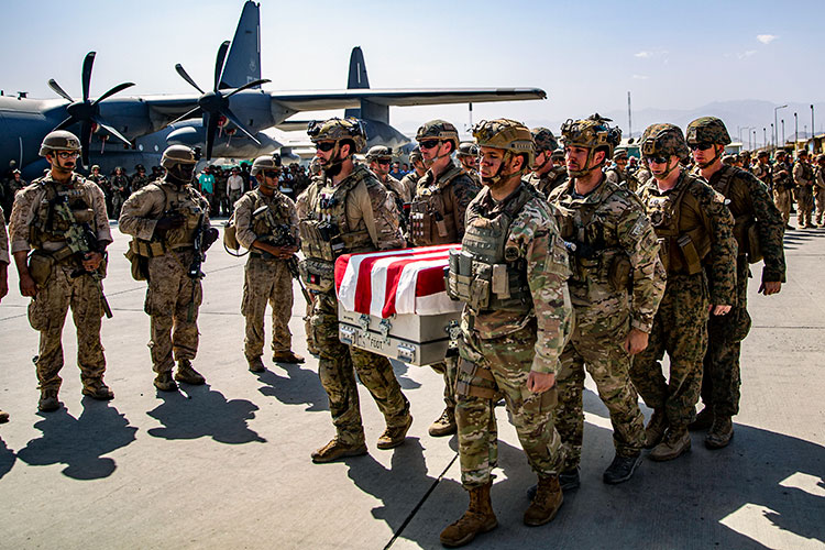 US marines carry the casket