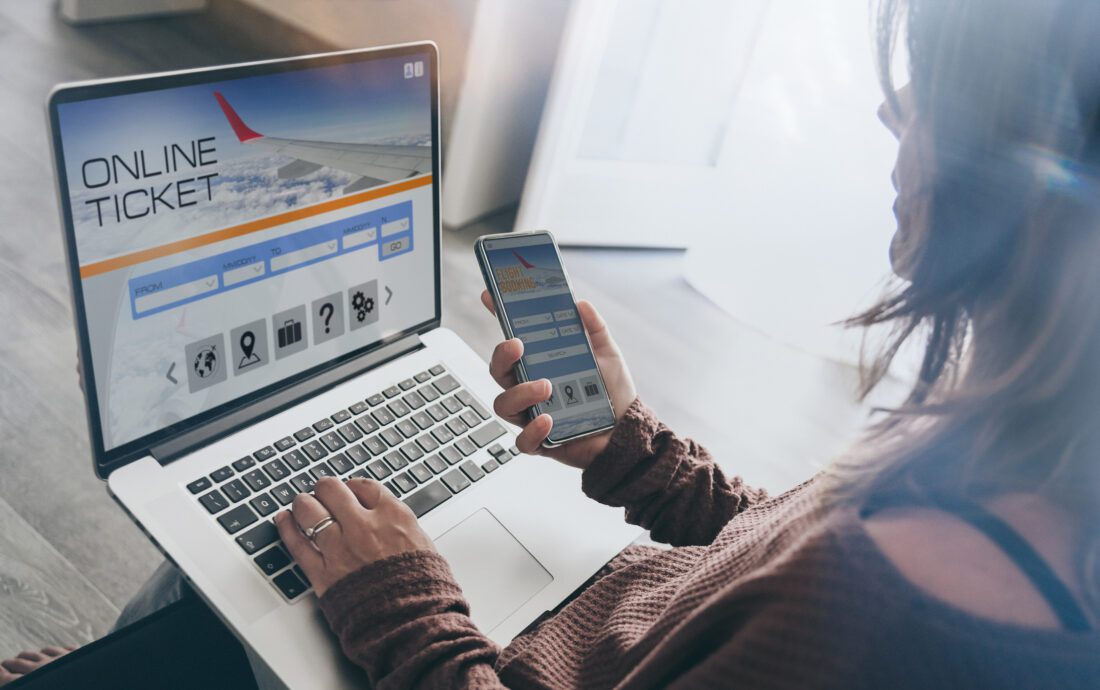 image of woman trying to buy an airline ticket on her computer