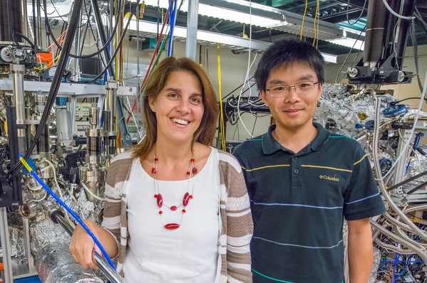 image of woman and man standing in front of lab machine