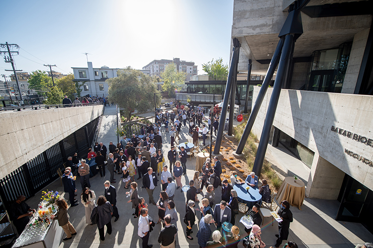 A crowd of people outside of the BBH building.