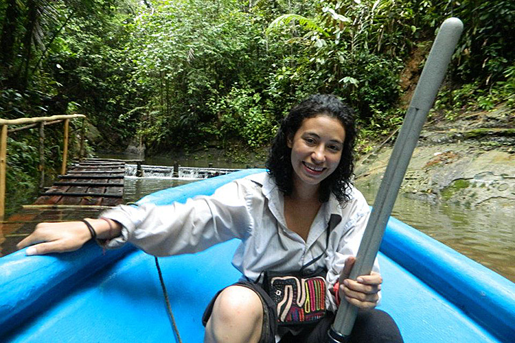 Valeria Ramírez-Castañeda in a boat in the Colombian jungle
