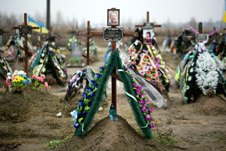 Decorations mark the graves of men and women in Bucha, Ukraine, who were killed by invading Russian troops after the invasion in February 2022