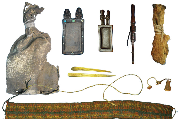 Ritual bundle with leather bag, carved wooden snuff tablets and snuff tube with human hair braids, pouch made of fox snouts and camelid bone spatulas. 