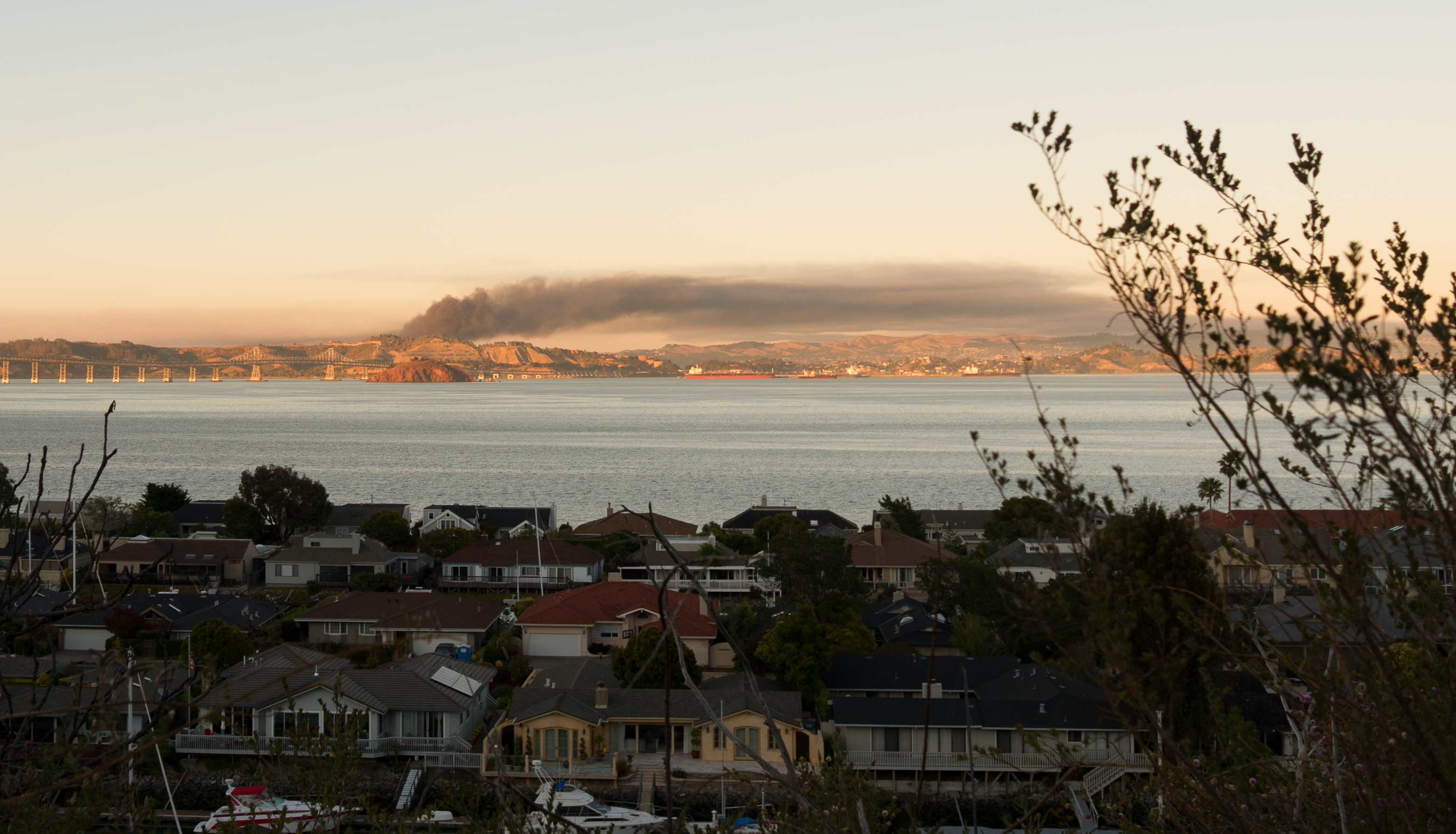 A view of smoke across the Bay from a fire at an oil refinery.