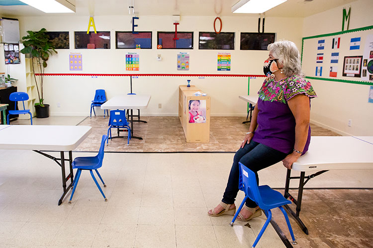 Beatriz Leyva-Cutler, executive director of Bay Area Hispano Institute for Advancement Inc. (BAHIA), sits in an empty classroom