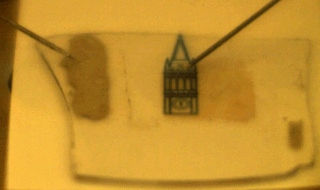 Image of demo of bright-light emitting device with image of campanile