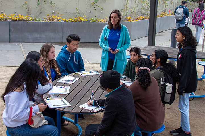 A group of teen scientists prepare to collect data for their biodiversity study of the Outdoor Nature Lab