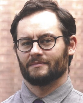 headshot of man in glasses 