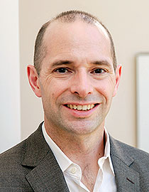 headshot of man smiling