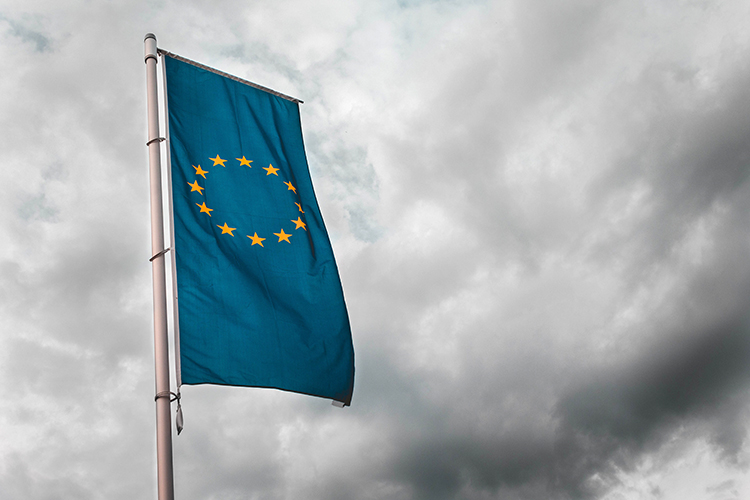 the European flag in a cloudy sky