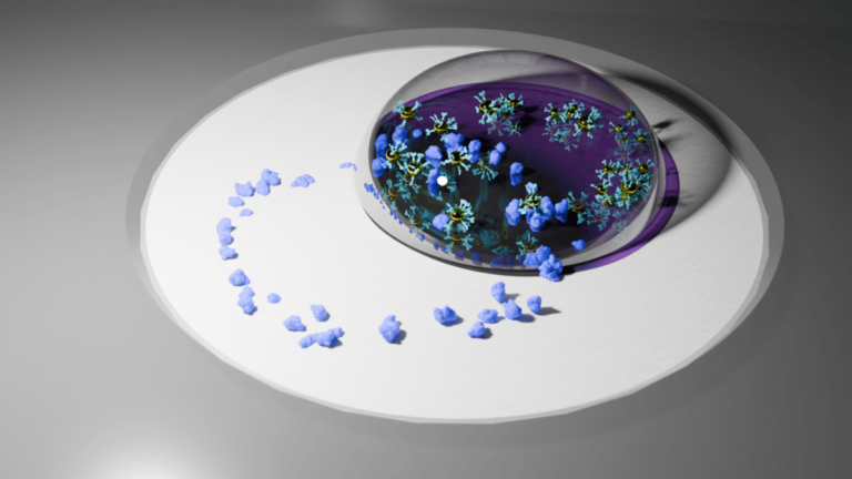 An illustration shows a ring of small purple particles, representing disease proteins, sitting on a surface. The ring is partially covered by a droplet of liquid containing enlarged cartoons of plasmonic particles.