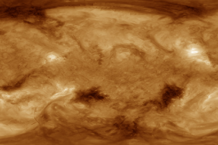 amber colored map of sun's surface, with dark and bright regions
