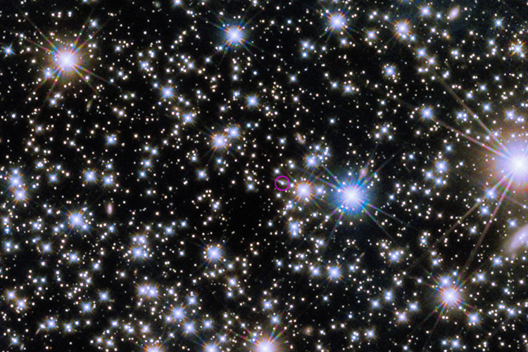 a field of stars with the source of the GRB circled