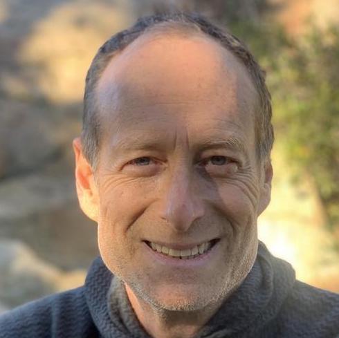 headshot of man smiling