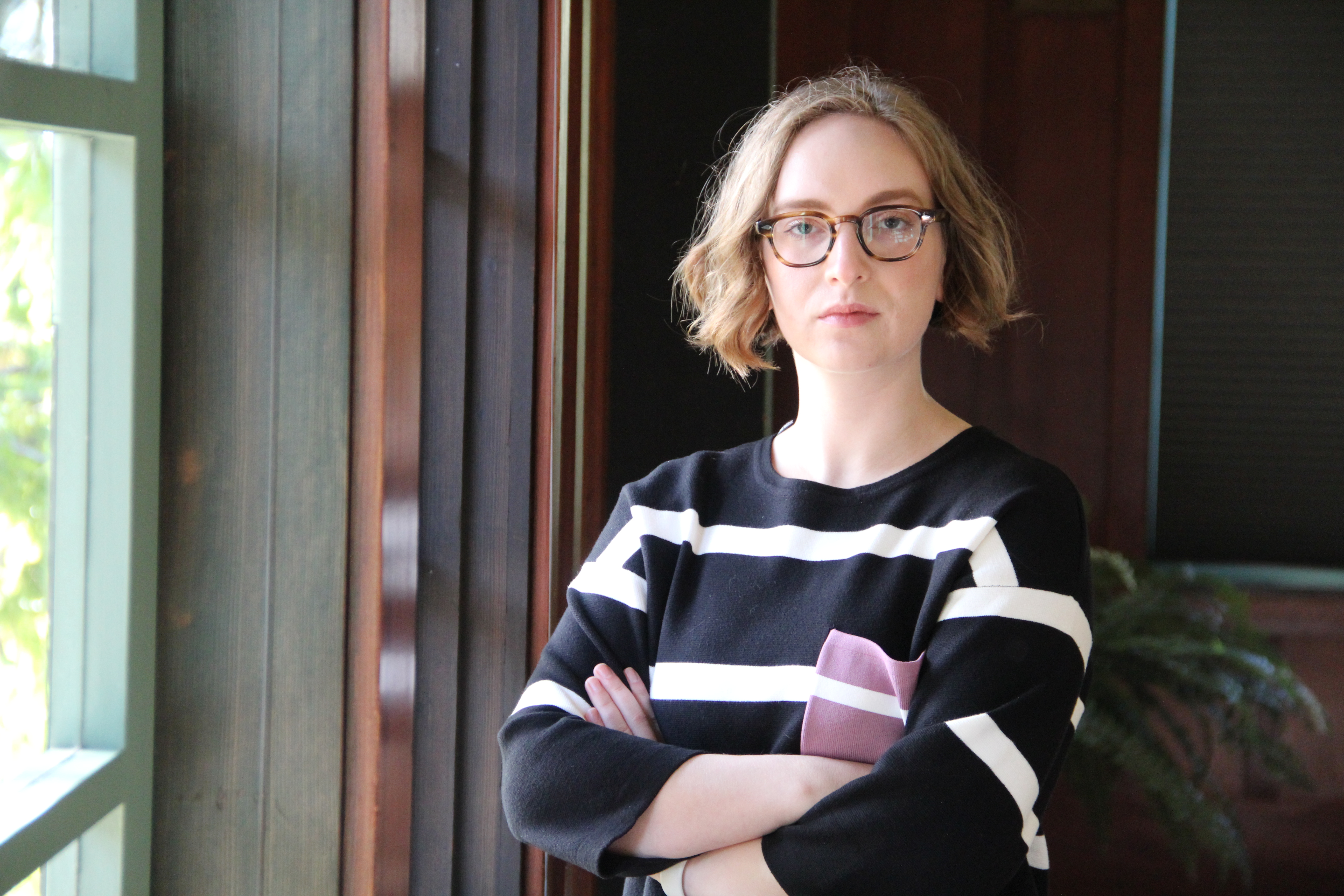Sarah Powazek, program director of public interest security at the UC Berkeley Center for Long-Term Cybersecurity, looks at the camera with a serious expression on her face, her arms crossed.