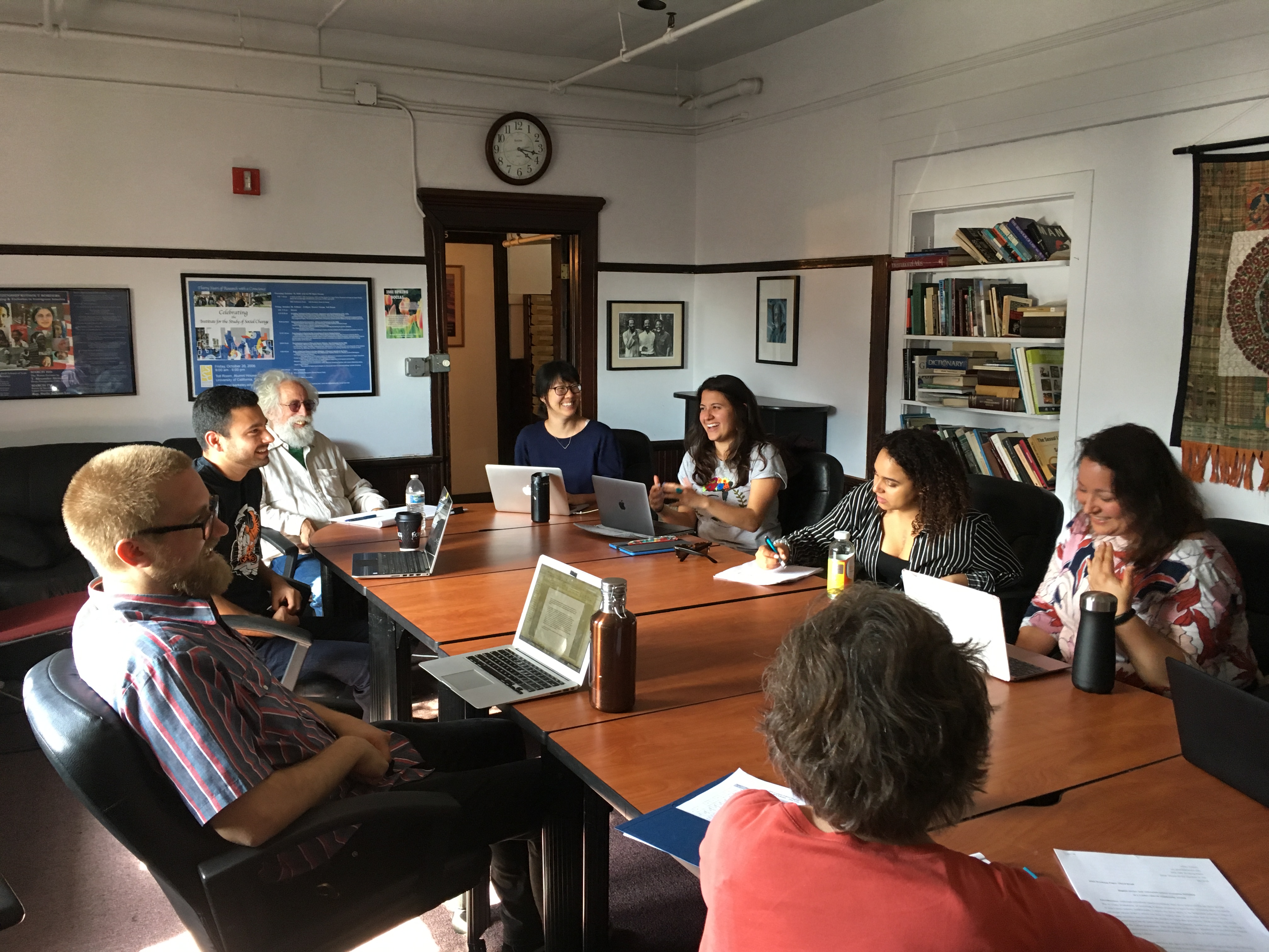 People sitting at table for group training session.