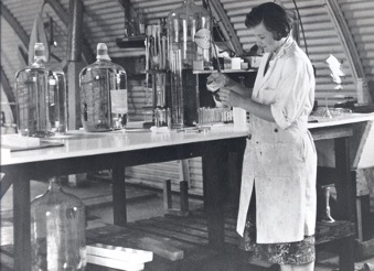 Archival photo of Alice Schwartz working in the Bio-Rad lab
