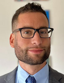 headshot of man in glasses 