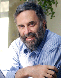 Informal headshot James Fishkin, in a blue-striped shirt. Fishkin directs the Stanford Deliberative Democracy Lab