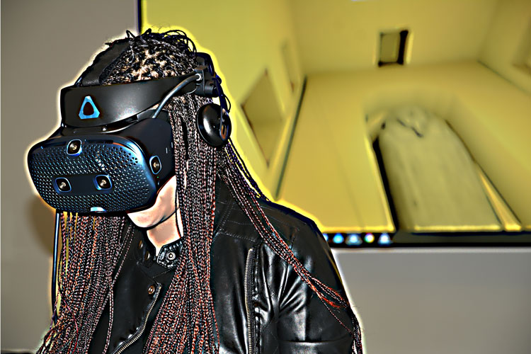 Jessica Johnson, a doctoral student in Egyptology, uses a Vive Cosmos VR headset to explore a recreation of the 2,500-year-old tomb of Psamtik.