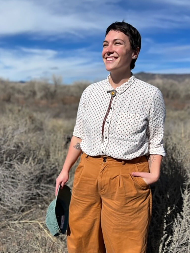 image of woman standing up and smiling