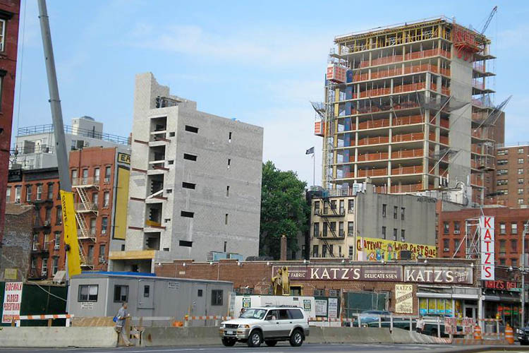 an image of a new building going up next to an old one