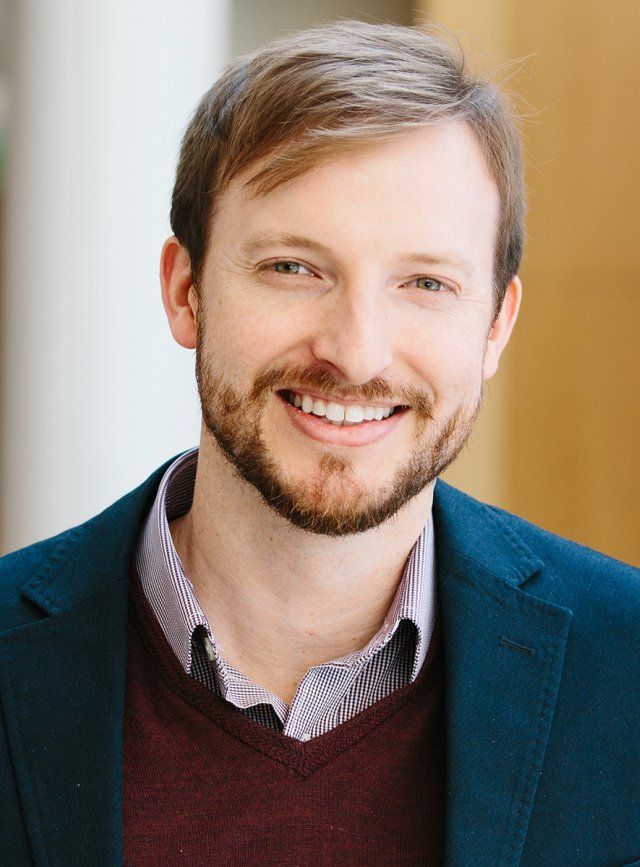 headshot of man smiling 