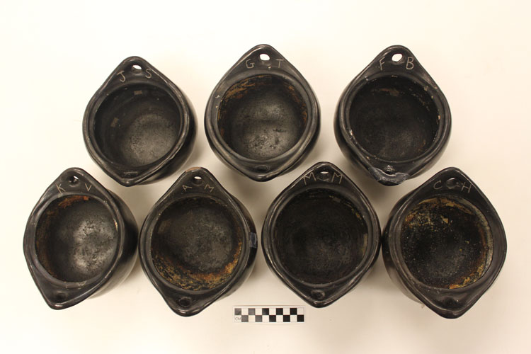 Seven La Chamba pots used in experiment on the residue of past meals cooked.