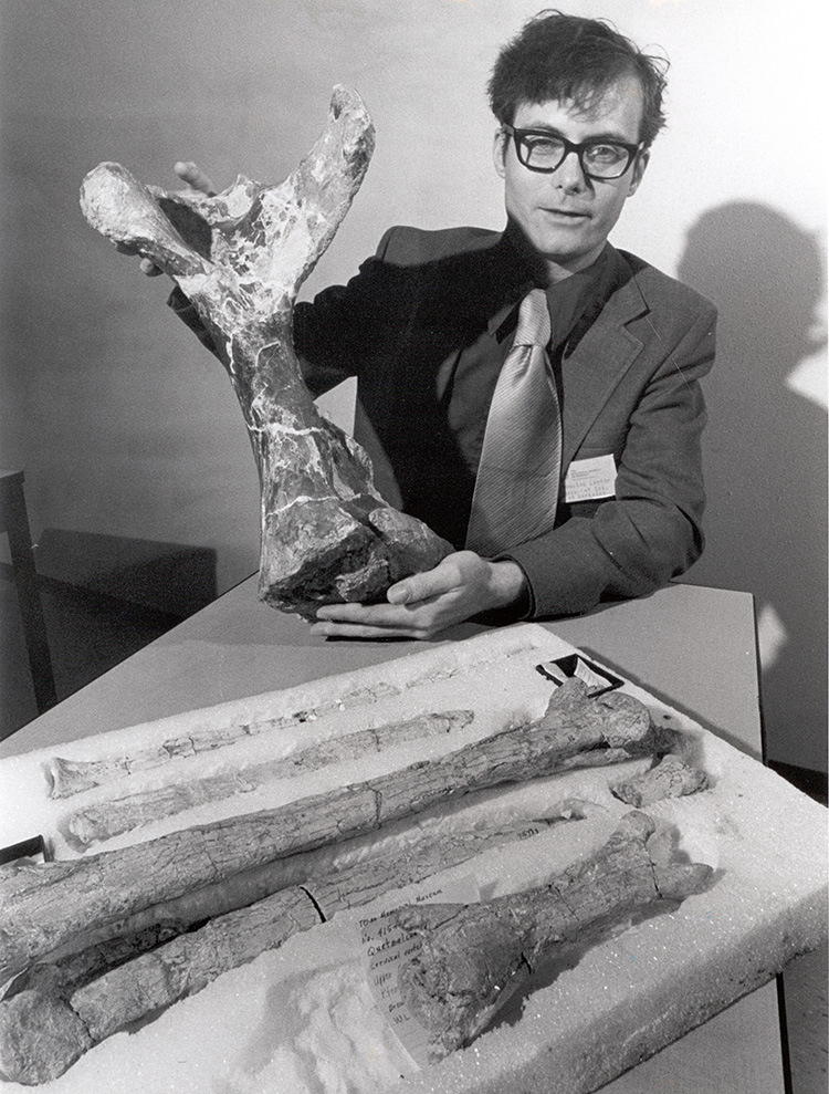1975 black and white photo of Douglas Lawson with fossil bone