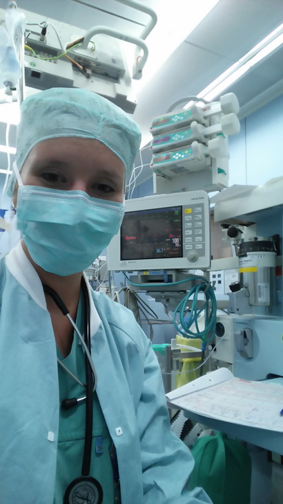 Lendner dressed in scrubs in an operating room