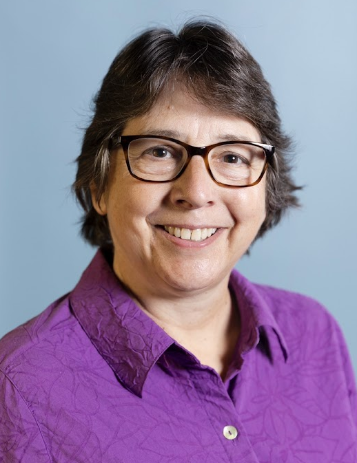 image of headshot of woman in glasses smiling