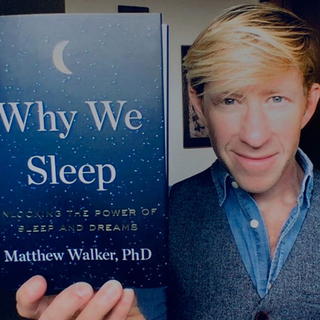 Matthew Walker holding his book Why We Sleep
