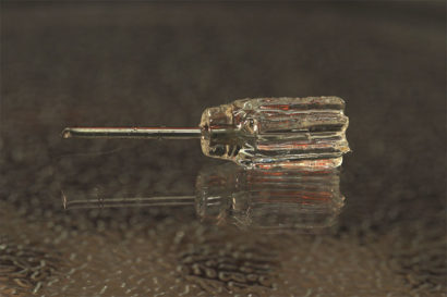 A photo of a screwdriver with a clear handle.