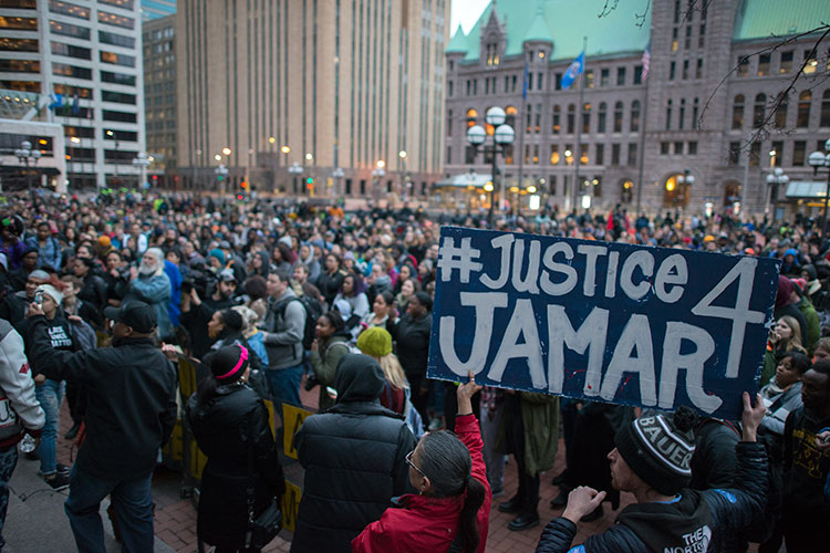 A large, diverse crowd gathers in Minneapolis in March 2016 to protest the police killing of 24-year-old Jamar Clark several months earlier.