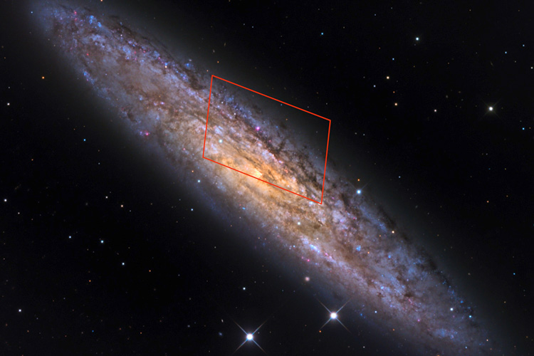a red box shows the location of magnetar in the galaxy NGC 253, a beautiful spiral galaxy